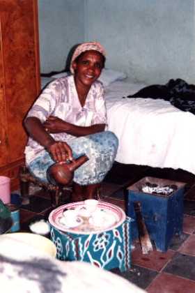 Eritrea - Asmara - Sembel. Asters sister in law making Eritrean coffee