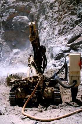 Eritrea - close to Barentu. A drill is used to widen the road. Road maintenance, widening and paving continues unabated, despite of the conflict with Ethiopia.