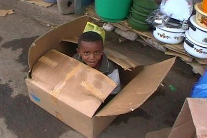 Little boy just outside Medeber market Asmara.