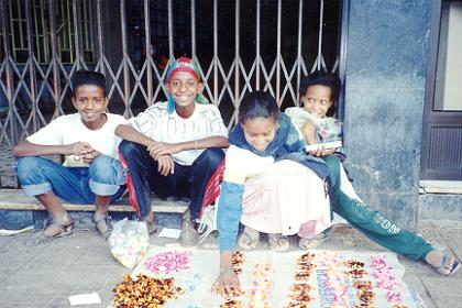 Children selling sweeties to earn some extra income for their family.