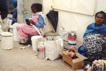 Woman selling eggs and chicken at the Asmara market.