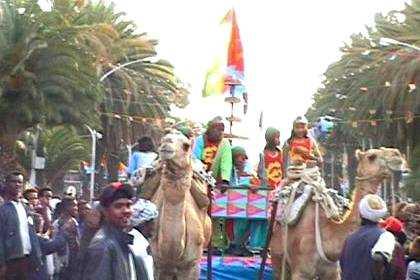 Children singing "Happy birthday" and bringing an ode to the camel, one of their most valuable means of transport during the 30 year liberation struggle and the national symbol of the state of Eritrea.