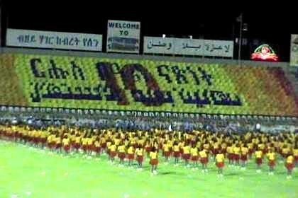 Thousands of schoolgirls giving a dance performance - Asmara Stadium.