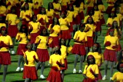 Thousands of schoolgirls giving a dance performance - Asmara Stadium.