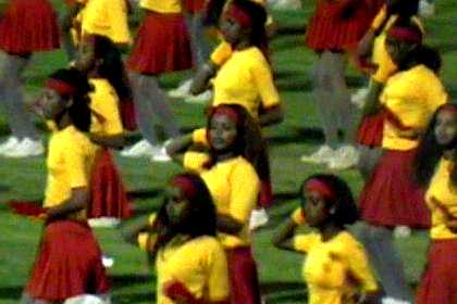 Thousands of schoolgirls giving a dance performance - Asmara Stadium.