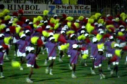 Thousands of schoolgirls giving a dance performance - Asmara Stadium.