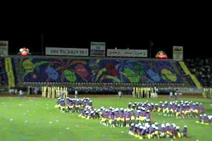 Thousands of schoolgirls giving a dance performance - Asmara Stadium.