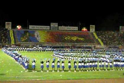 Thousands of schoolgirls giving a dance performance - Asmara Stadium.