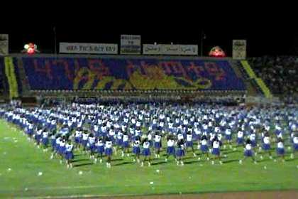 Thousands of schoolgirls giving a dance performance - Asmara Stadium.