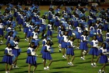 Thousands of schoolgirls giving a dance performance - Asmara Stadium.