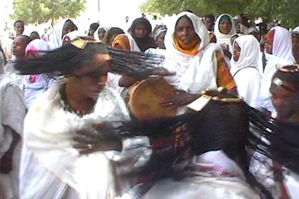 Tigre women dance the sheleel, swinging their long plaited hair vigorously across their faces at the festival of Mariam Dearit.