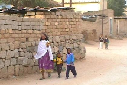 Woman with her children in Keren street.