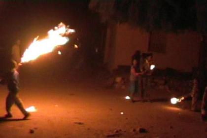 Children lighting torches to celebrate K'ddus Yohannes (New Year).