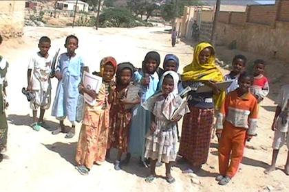 Muslim children making fun in front of my camera on the streets of Keren.