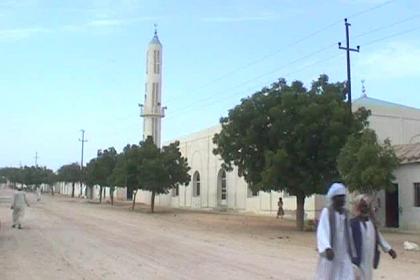 The minaret of the mosque in the main street marks the town center of Afabet.
