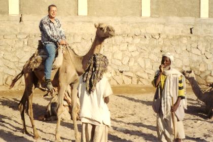 Riding the camel in the dry riverbed in Keren.