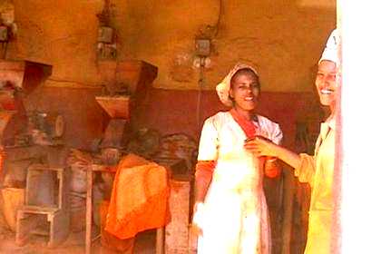 Girls in one of the workshops - processing "berbere", a mixture of spices.