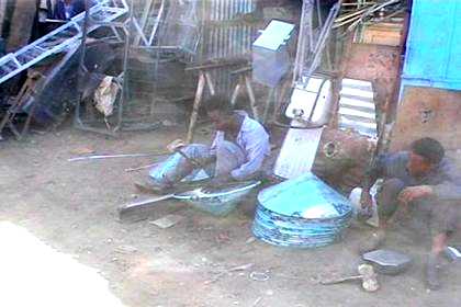 Medeber markets - boys producing kitchen materials from empty oil cans.