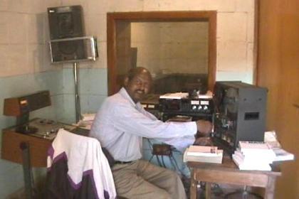 Kahsay in his little studio broadcasting radio programs in eight languages.