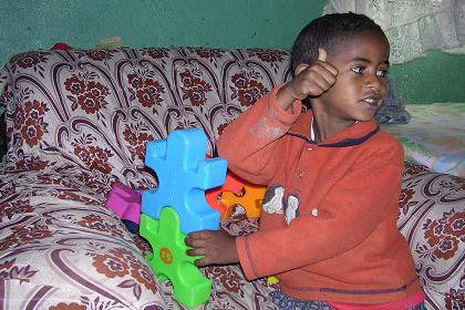 Son of Feshaye approving the toys  - Asmara Eritrea.