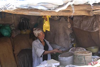 Woman selling grain and spices - Medeber market Asmara.