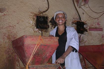 Girl posing in one of the workshops - Medeber market Asmara.
