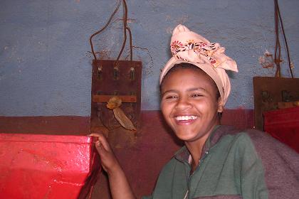 Girl posing in one of the workshops - Medeber market Asmara.