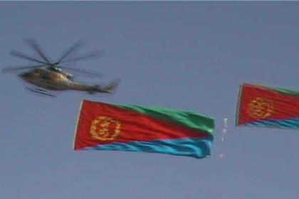 Helicopters pulling banners through the Asmara sky.