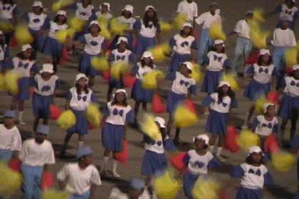 Thousands of students dancing on traditional music.