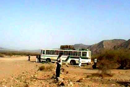 Changing a tire in the Denkalia dessert.