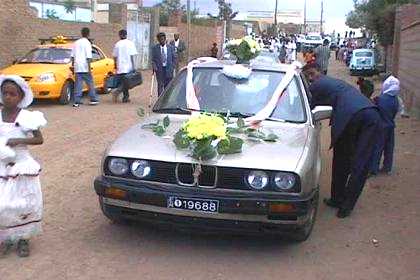 Bride and bridegroom leaving the wedding.