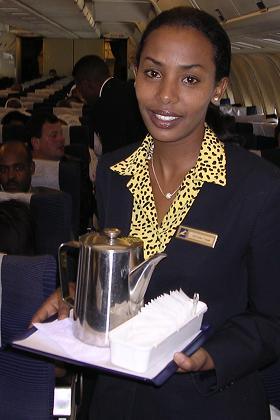 Flight attendant Eden serving coffee on the flight to Asmara.
