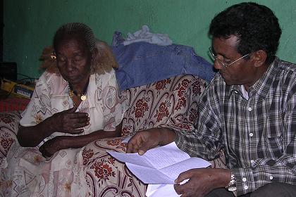 Feshaye reading the letters from Holland to his mother.