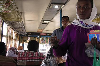 Selling household utensils in the Asmara - Keren bus.