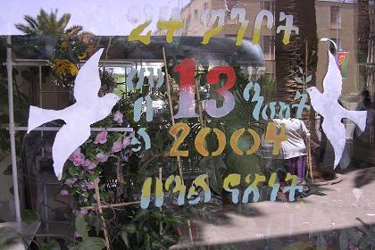 "May 24th, celebrating 13 years liberation, Independence Day 2004". Decorated pharmacy shop window - Edaga Arbi Asmara Eritrea.