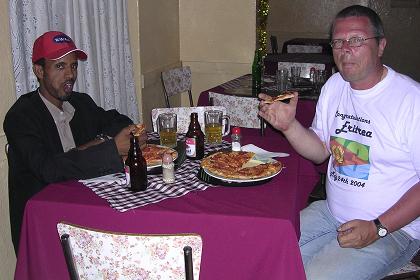 Eating a pizza with Kibreab in Pizzeria Eritrea - Asmara Eritrea.