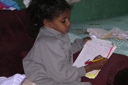 Alana writing a letter to Mebrat - Asmara Eritrea.