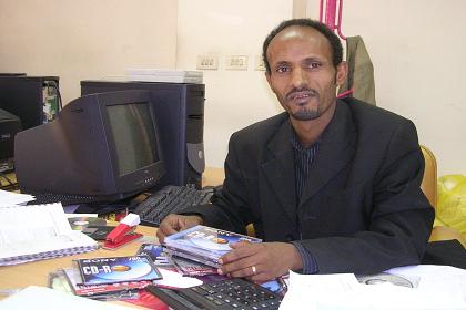 Kibreab in his office of the Housing and Commerce Bank - Asmara.