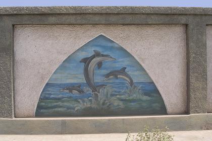 Dolphins on a wall painting near the tank monument - Massawa Eritrea.