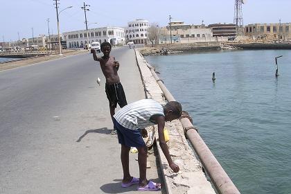 Two boys fishing on the causeway to Batse - Massawa Eritrea.