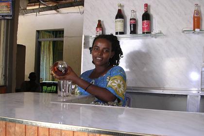 Senait, lady bartender in Edaga Berai - Massawa Eritrea.