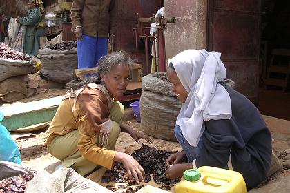 Women processing chili peppers - Medeber markets Asmara Eritrea.
