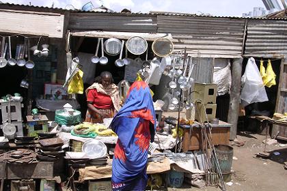 Woman selling household utensils - Medeber markets Asmara Eritrea.