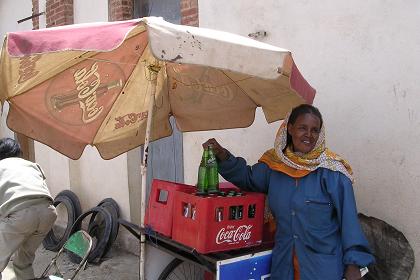 Woman selling Coca Cola - Medeber markets Asmara Eritrea.