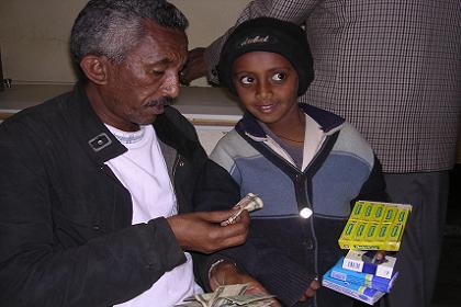 Boy selling cigarettes and chewing gum, Bar Selas - Asmara Eritrea.