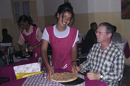 Bisrat serving my pizza - Pizzeria Eritrea - Asmara Eritrea.