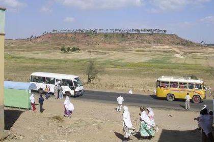 Bus stop, modern mini bus and Fiat old timer - Adi Abeito Asmara Eritrea.