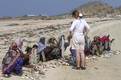 Women selling souvenirs on Dissei Island.