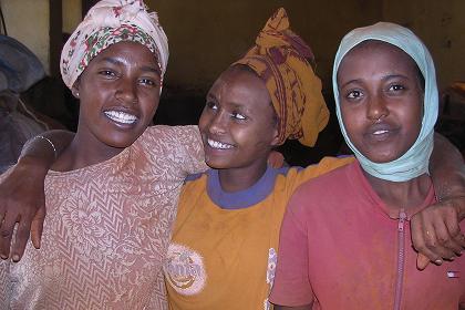 Three young women in a chili-pepper mill - Medeber markets Asmara Eritrea.