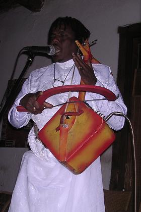 Artist playing a traditional instrument (Watta) Hidmona Bar & Restaurant - Expo, Asmara Eritrea.